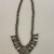Navajo. <em>Squash Blossom Necklace</em>, late 19th- early 20th century. Silver, turquoise, hide, twine Brooklyn Museum, Anonymous gift, 10.228. Creative Commons-BY (Photo: Brooklyn Museum, CUR.10.228_view01.jpg)