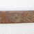 Ainu. <em>Long Rather Wide Prayer Stick</em>. Wood, 1 3/8 x 13 1/16 in. (3.5 x 33.2 cm). Brooklyn Museum, Gift of Herman Stutzer, 12.257. Creative Commons-BY (Photo: Brooklyn Museum, CUR.12.257_bottom.jpg)