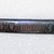 Ainu. <em>Long Narrow Prayer Stick</em>. Wood, 7/8 x 12 7/8 in. (2.2 x 32.7 cm). Brooklyn Museum, Gift of Herman Stutzer, 12.283. Creative Commons-BY (Photo: Brooklyn Museum, CUR.12.283_top.jpg)