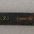 Ainu. <em>Long Straight Prayer Stick</em>. Lacquer, 1 x 13 3/8 in. (2.5 x 34 cm). Brooklyn Museum, Gift of Herman Stutzer, 12.303. Creative Commons-BY (Photo: Brooklyn Museum, CUR.12.303_bottom.jpg)