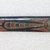 Ainu. <em>Prayer Stick</em>. Lacquer, 1 1/8 x 13 in. (2.8 x 33 cm). Brooklyn Museum, Gift of Herman Stutzer, 12.318. Creative Commons-BY (Photo: Brooklyn Museum, CUR.12.318_top.jpg)