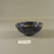 Roman. <em>Mosaic Bowl</em>, 1st century B.C.E.–early 1st century C.E. Glass, 1 3/8 × Diam. 3 1/2 in. (3.5 × 8.9 cm). Brooklyn Museum, Gift of Robert B. Woodward, 15.262. Creative Commons-BY (Photo: Brooklyn Museum, CUR.15.262_view2.jpg)