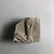 <em>Relief Fragment of a Human-headed Cobra</em>, 332 B.C.E.-100 C.E. Limestone (?), 2 5/16 × 2 9/16 × 1 5/8 in. (5.8 × 6.5 × 4.2 cm). Brooklyn Museum, Gift of Evangeline Wilbour Blashfield, Theodora Wilbour, and Victor Wilbour honoring the wishes of their mother, Charlotte Beebe Wilbour, as a memorial to their father, Charles Edwin Wilbour, 16.109. Creative Commons-BY (Photo: , CUR.16.109_view05.jpg)
