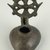 Coptic. <em>Lamp with Elaborate Handle</em>, 5th-6th century C.E. Bronze, 1 5/8 x 3 3/8 in. (4.2 x 8.6 cm). Brooklyn Museum, Gift of Evangeline Wilbour Blashfield, Theodora Wilbour, and Victor Wilbour honoring the wishes of their mother, Charlotte Beebe Wilbour, as a memorial to their father, Charles Edwin Wilbour, 16.133. Creative Commons-BY (Photo: Brooklyn Museum (in collaboration with Index of Christian Art, Princeton University), CUR.16.133_view1_ICA.jpg)