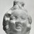 Graeco-Egyptian. <em>Head of a Child</em>. Terracotta, 1 3/4 x 1 1/4 x 1 3/8 in. (4.5 x 3.2 x 3.6 cm). Brooklyn Museum, Gift of Evangeline Wilbour Blashfield, Theodora Wilbour, and Victor Wilbour honoring the wishes of their mother, Charlotte Beebe Wilbour, as a memorial to their father, Charles Edwin Wilbour, 16.307. Creative Commons-BY (Photo: Brooklyn Museum, CUR.16.307_NegD_print_bw.jpg)