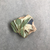  <em>Fragment of a Tile</em>, ca. 1352-1336 B.C.E. Faience, 3/8 × 1 7/16 × 1 9/16 in. (0.9 × 3.7 × 4 cm). Brooklyn Museum, Gift of Evangeline Wilbour Blashfield, Theodora Wilbour, and Victor Wilbour honoring the wishes of their mother, Charlotte Beebe Wilbour, as a memorial to their father, Charles Edwin Wilbour, 16.332. Creative Commons-BY (Photo: , CUR.16.332_view01.jpg)
