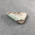  <em>Fragment of Tile</em>, ca. 1352-1332 B.C.E. Faience, 1 1/8 × 3/16 × 1 1/2 in. (2.9 × 0.5 × 3.8 cm). Brooklyn Museum, Gift of Evangeline Wilbour Blashfield, Theodora Wilbour, and Victor Wilbour honoring the wishes of their mother, Charlotte Beebe Wilbour, as a memorial to their father, Charles Edwin Wilbour, 16.342. Creative Commons-BY (Photo: , CUR.16.342_view03.jpg)