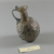 Roman. <em>Bulbous Bottle with Band of Lozenges</em>, second half 1st century C.E. (probably). Glass, 3 1/16 x Diam. 1 15/16 in. (7.7 x 4.9 cm) . Brooklyn Museum, Robert B. Woodward Memorial Fund, 19.16. Creative Commons-BY (Photo: Brooklyn Museum, CUR.19.16_view3.jpg)