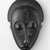 Baule. <em>Mblo Portrait Mask</em>, late 19th or early 20th century. Wood, oils, pigment, 10 1/2 x 5 3/8 x 3 in.(26.7 x 13.7 x 7.6 cm). Brooklyn Museum, The Adolph and Esther D. Gottlieb Collection, 1989.51.25. Creative Commons-BY (Photo: Brooklyn Museum, CUR.1989.51.25_print_bw.jpg)