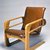 Kem Weber (American, born Germany, 1889-1963). <em>Armchair ("Airline Chair")</em>, 1934-1935. Wood, Naugahyde, leather, metal, 34 1/4 x 25 x 34 1/2 in. (87 x 63.5 x 87.6 cm). Brooklyn Museum, Modernism Benefit Fund, 1991.104. Creative Commons-BY (Photo: Brooklyn Museum, CUR.1991.104.jpg)