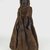 Bobo. <em>Figure of a Female</em>, early 20th century. Wood, cloth, cowrie shell, metal, 14 1/4 x 4 x 4 in. (36.2 x 10.2 x 10.2 cm). Brooklyn Museum, Gift of Eugene and Harriet Becker, 1991.226.2. Creative Commons-BY (Photo: Brooklyn Museum, CUR.1991.226.2_front_PS5.jpg)
