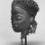Chokwe. <em>Mask (Mwana Pwo)</em>, early 20th century. Wood, fiber, metal, 12 x 8 1/2 x 9 in. (30.5 x 21.5 x 22.7 cm). Brooklyn Museum, Gift of Corice and Armand P. Arman, 1992.133.3. Creative Commons-BY (Photo: Brooklyn Museum, CUR.1992.133.3_print_threequarter_bw.jpg)