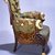 Pottier & Stymus Manufacturing Company (United States, New York, active ca. 1859-1910). <em>Armchair (Egyptian Revival style)</em>, ca. 1870. Rosewood, burl walnut, gilt and patinated metal mounts, original upholstery, 38 1/4 x 30 x 29 in.  (97.2 x 76.2 x 73.7 cm). Brooklyn Museum, Bequest of Marie Bernice Bitzer, by exchange and anonymous gift, 1992.89. Creative Commons-BY (Photo: Brooklyn Museum, CUR.1992.89_side.jpg)