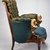 Pottier & Stymus Manufacturing Company (United States, New York, active ca. 1859-1910). <em>Armchair (Egyptian Revival style)</em>, ca. 1870. Rosewood, burl walnut, gilt and patinated metal mounts, original upholstery, 38 1/4 x 30 x 29 in.  (97.2 x 76.2 x 73.7 cm). Brooklyn Museum, Bequest of Marie Bernice Bitzer, by exchange and anonymous gift, 1992.89. Creative Commons-BY (Photo: Brooklyn Museum, CUR.1992.89_side_after_conservation.jpg)