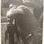 Leon Levinstein (American, 1910-1988). <em>[Untitled] (Man with Hat Leaning on a Fence)</em>, ca. 1952. Gelatin silver print, sheet: 14 3/4 × 11 1/2 in. (37.5 × 29.2 cm). Brooklyn Museum, Gift of Stuart Karu, 1995.209.5. © artist or artist's estate (Photo: Brooklyn Museum, CUR.1995.209.5.jpg)
