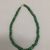 Maya. <em>Necklace</em>, 300–600. Jade beads (prehispanic), metal chain and clasp (modern), 3/8 × 3/8 × 16 in. (1 × 1 × 40.6 cm). Brooklyn Museum, Bequest of Mrs. Carl L. Selden, 1996.116.4. Creative Commons-BY (Photo: , CUR.1996.116.4.jpg)