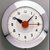 Henry Dreyfuss (American, 1904-1972). <em>Wafer Clock, Model SK 174</em>, ca. 1940. Metal, glass, 7 1/2 x 7 1/8 x 2 3/4 in. (19.1 x 18.1 x 7 cm). Brooklyn Museum, Gift of Eva, Alan, and Louis Brill, 1998.143.5. Creative Commons-BY (Photo: Brooklyn Museum, CUR.1998.143.5.jpg)