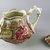  <em>Teapot, "Geisha,"</em> Registered (shape)1898; Registered (design)1899. Glazed earthenware, 7 x 9 1/2 x 5 1/2 in.  (17.8 x 24.1 x 14.0 cm). Brooklyn Museum, Gift of Paul F. Walter, 1999.29.57a-b. Creative Commons-BY (Photo: Brooklyn Museum, CUR.1999.29.57a-b.jpg)