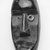 Guerze. <em>Miniature Mask</em>, late 19th-early 20th century. Wood, aluminum, 5 3/4 x 2 5/8 x 1 7/8 in.  (14.6 x 6.7 x 4.8 cm). Brooklyn Museum, Gift of Blake Robinson, 2000.70.2. Creative Commons-BY (Photo: Brooklyn Museum, CUR.2000.70.2_print_front_bw.jpg)