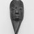 Mano. <em>Miniature Mask</em>, late 19th-early 20th century. Wood, aluminum, 6 x 2 3/8 x 1 7/8 in.  (15.2 x 6.0 x 4.8 cm). Brooklyn Museum, Gift of Blake Robinson, 2000.70.4. Creative Commons-BY (Photo: Brooklyn Museum, CUR.2000.70.4_print_front_bw.jpg)
