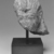  <em>Fragmentary Head of A King, probably Ramesses II</em>, ca. 1279–1213 B.C.E. Gray granite, 7 11/16 x 6 7/8 x 9 1/16 in.  (19.5 x 17.5 x 23.0 cm). Brooklyn Museum, Partial gift of James Lamb in honor of Paul O'Rourke and Charles Edwin Wilbour Fund, 2001.56. Creative Commons-BY (Photo: Brooklyn Museum, CUR.2001.56_NegA_print_bw.jpg)