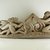 Asmat. <em>Canoe Ornament of Three Seated Figures and a Fish</em>, mid-20th century. Wood, pigment traces, 10 x 33 in. (25.4 x 83.8 cm). Brooklyn Museum, Gift of the Mortimer F. Shapiro Trust, 2003.49.4. Creative Commons-BY (Photo: Brooklyn Museum, CUR.2003.49.4_side1_PS5.jpg)
