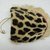 Mende. <em>Gbini Mask</em>, early 20th century. Wood, leopard skin, sheepskin, antelope skin, raffia fiber, raffia fiber twine, cotton cloth, cotton string, cowrie shells, Height: 17 in. (43.2 cm). Brooklyn Museum, Gift of William C. Siegmann, 2004.77a-d. Creative Commons-BY (Photo: Brooklyn Museum, CUR.2004.77b.jpg)