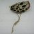 Mende. <em>Gbini Mask</em>, early 20th century. Wood, leopard skin, sheepskin, antelope skin, raffia fiber, raffia fiber twine, cotton cloth, cotton string, cowrie shells, Height: 17 in. (43.2 cm). Brooklyn Museum, Gift of William C. Siegmann, 2004.77a-d. Creative Commons-BY (Photo: Brooklyn Museum, CUR.2004.77d.jpg)