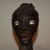 Songye. <em>Head</em>, 20th century. Wood, cowrie shell, fiber, organic materials, 7 1/2 x 2 3/4 x 3 3/8 in. (19 x 7 x 8.5 cm). Brooklyn Museum, Gift in memory of Frederic Zeller, 2014.54.45 (Photo: Brooklyn Museum, CUR.2014.54.45_detail1.jpg)