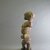 Possibly Igbo. <em>Figure of Maternity</em>, 20th century. Wood, 12 3/16 x 3 15/16 x 4 1/8 in. (31 x 10 x 10.5 cm). Brooklyn Museum, Gift in memory of Frederic Zeller, 2014.54.51 (Photo: Brooklyn Museum, CUR.2014.54.51_side.jpg)