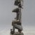 Possibly Dogon. <em>Figure of Seated Female</em>, 20th century. Wood, metal, 5 x 1 11/16 in. (12.8 x 4.3 cm). Brooklyn Museum, Gift in memory of Frederic Zeller, 2014.54.7 (Photo: Brooklyn Museum, CUR.2014.54.7_side.jpg)