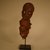 Bamum. <em>Figure</em>, 20th century. Wood, textile, teeth, reed, metal, 8 1/4 x 2 9/16 x 3 1/8 in. (21 x 6.5 x 8 cm). Brooklyn Museum, Gift in memory of Frederic Zeller, 2014.54.8 (Photo: Brooklyn Museum, CUR.2014.54.8_view01.jpg)