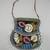 Iroquois. <em>Beaded Bag</em>, ca. 1880. Cloth, beads, silk, velvet, Including fringe but excluding strap: 8 1/2 × 1/2 × 7 1/4 in. (21.6 × 1.3 × 18.4 cm). Brooklyn Museum, Gift of the Edward J. Guarino Collection in honor of Kathleen Guarino-Burns, 2016.11.11. Creative Commons-BY (Photo: , CUR.2016.11.11_view02.jpg)