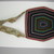Seneca. <em>Beaded Bag</em>, ca. 1835. Cloth, beads, Including strap: 6 1/4 × 1/8 × 12 3/4 in. (15.9 × 0.3 × 32.4 cm). Brooklyn Museum, Gift of the Edward J. Guarino Collection in memory of Edgar J. Guarino, 2016.11.6. Creative Commons-BY (Photo: , CUR.2016.11.6_view01.jpg)
