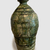 Okabe Mineo (Japanese, 1919–1990). <em>Bottle Vase</em>, ca. 1970. Stoneware with oribe glaze, 8 11/16 × 4 5/16 in. (22 × 11 cm). Brooklyn Museum, Partial gift of Steven Korff and Marcia Van Wagner and Bertram H. Schaffner Asian Art Fund, 2020.1.2 (Photo: , CUR.2020.1.2_side2_edited.jpg)