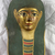  <em>Cartonnage Mummy Mask</em>, ca. 330 B.C.E.-50 C.E. Gesso, gilding, pigment, gauze or linen, 14 3/16 × 10 13/16 × 8 11/16 in. (36 × 27.5 × 22 cm). Brooklyn Museum, Bequest of Harold and Mildred Jacobs, 2022.1.1 (Photo: Brooklyn Museum, CUR.2022.1.1_view01.jpg)