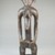 Senufo. <em>Figure of a Seated Woman</em>, late 19th or early 20th century. Wood, glass beads, 12 x 3 x 2 3/4 in. (30.5 x 7.6 x 7 cm). Brooklyn Museum, Museum Expedition 1922, Robert B. Woodward Memorial Fund, 22.1092. Creative Commons-BY (Photo: Brooklyn Museum, CUR.22.1092_front_PS5.jpg)