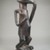 Possibly Luba. <em>Figure of a Standing Female</em>, late 19th or early 20th century. Wood, 11 x 3 1/4 x 4 in. (27.9 x 8.3 x 10.2 cm). Brooklyn Museum, Museum Expedition 1922, Robert B. Woodward Memorial Fund, 22.1129. Creative Commons-BY (Photo: Brooklyn Museum, CUR.22.1129_threequarter_PS5.jpg)