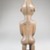 Possibly Vili. <em>Kneeling Female Figure</em>, late 19th or early 20th century. Wood, applied materials, 8 1/2 x 2 3/8 in. (21.6 x 6 cm). Brooklyn Museum, Museum Expedition 1922, Robert B. Woodward Memorial Fund, 22.1140. Creative Commons-BY (Photo: Brooklyn Museum, CUR.22.1140_back_PS5.jpg)