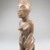 Possibly Vili. <em>Kneeling Female Figure</em>, late 19th or early 20th century. Wood, applied materials, 8 1/2 x 2 3/8 in. (21.6 x 6 cm). Brooklyn Museum, Museum Expedition 1922, Robert B. Woodward Memorial Fund, 22.1140. Creative Commons-BY (Photo: Brooklyn Museum, CUR.22.1140_threequarter_PS5.jpg)