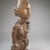 Yombe. <em>Female Figure Seated on Animal</em>, 19th century. Wood, seed pod, plastic beads, copper alloy, 12 x 4 x 3 3/4in. (30.5 x 10.2 x 9.5cm). Brooklyn Museum, Museum Expedition 1922, Robert B. Woodward Memorial Fund, 22.1141. Creative Commons-BY (Photo: Brooklyn Museum, CUR.22.1141_threequarter_PS5.jpg)