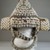 Kuba. <em>Headdress</em>, late 19th or early 20th century. Cowrie shell, fiber, wood, 13 3/4 x 13 3/8 in.  (34.9 x 34.0 cm). Brooklyn Museum, Museum Expedition 1922, Robert B. Woodward Memorial Fund, 22.1443. Creative Commons-BY (Photo: Brooklyn Museum, CUR.22.1443_front_PS5.jpg)