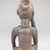 Vili. <em>Seated Male Figure</em>, late 19th or early 20th century. Wood, shell, metal, resin, pigment, 5 x 2 1/8 x 2 3/4 in. (12.5 x 5.5 x 7.0 cm). Brooklyn Museum, Museum Expedition 1922, Robert B. Woodward Memorial Fund, 22.1450. Creative Commons-BY (Photo: Brooklyn Museum, CUR.22.1450_back_PS5.jpg)