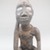 Vili. <em>Seated Male Figure</em>, late 19th or early 20th century. Wood, shell, metal, resin, pigment, 5 x 2 1/8 x 2 3/4 in. (12.5 x 5.5 x 7.0 cm). Brooklyn Museum, Museum Expedition 1922, Robert B. Woodward Memorial Fund, 22.1450. Creative Commons-BY (Photo: Brooklyn Museum, CUR.22.1450_front_PS5.jpg)
