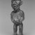 Vili. <em>Standing Male Figure (Nkonde)</em>, 19th century. Wood, resin, glass mirror, ferrous nails, 7 3/4 x 2 1/2 x 2in. (19.7 x 6.4 x 5.1cm). Brooklyn Museum, Museum Expedition 1922, Robert B. Woodward Memorial Fund, 22.1458. Creative Commons-BY (Photo: Brooklyn Museum, CUR.22.1458_print_threequarter_bw.jpg)