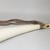 Zande. <em>Horn</em>, late 19th or early 20th century. Ivory, fiber cord, 21 9/16 x 3 3/4 in. (54.7 x 9.5 cm). Brooklyn Museum, Brooklyn Museum Collection, 22.760. Creative Commons-BY (Photo: Brooklyn Museum, CUR.22.760_top_PS5.jpg)