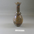 Roman. <em>Bottle with Stylized Grape Pattern</em>, 3rd century C.E. Glass, Greatest diam.  2 5/16 x 5 11/16 in. (5.9 x 14.5 cm). Brooklyn Museum, Brooklyn Museum Collection, 23.14. Creative Commons-BY (Photo: Brooklyn Museum, CUR.23.14_view1.jpg)
