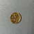 Cypriot. <em>Small Disk</em>, 1st century B.C.E. Gold, 13/16 × 13/16 in. (2.1 × 2.1 cm). Brooklyn Museum, Gift of George D. Pratt, 26.771. Creative Commons-BY (Photo: Brooklyn Museum, CUR.26.771_overall.JPG)
