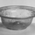 Roman. <em>Bowl</em>, 1st-2nd century C.E. Glass, 1 7/16 x Diam. 4 1/4 in. (3.7 x 10.8 cm). Brooklyn Museum, Anonymous gift, 27.726. Creative Commons-BY (Photo: Brooklyn Museum, CUR.27.726_negB_bw.jpg)