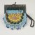 Blackfoot. <em>Beaded Purse</em>, early 20th century. Beads, hide, metal, 3 1/2 x 4 in. (8.9 x 10.2 cm). Brooklyn Museum, Bequest of W.S. Morton Mead, 32.2099.32547. Creative Commons-BY (Photo: Brooklyn Museum, CUR.32.2099.32547_view1.jpg)